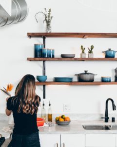 woman tending the kitchen